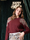 Pull con ricami di paillettes sulle spalle